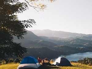 Group camping by a fire

